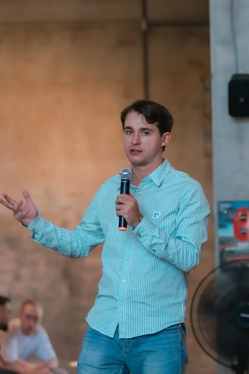 Charles Floate speaking on stage